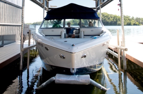 NX Guide System  positioning a boat securely on a lift with poly-covered guides