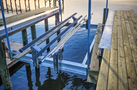 Lift cradle raised to tube bottoms—no cradle locks or straps required on a ShoreStation lift